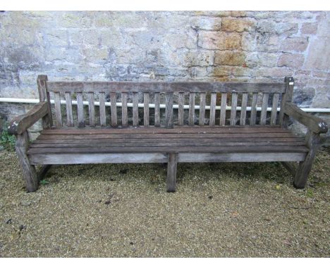 A good quality teak garden bench, 240cm long approx 