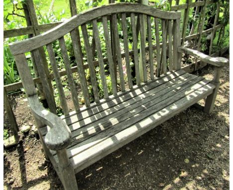 A weathered teak garden bench, 160cm wide 