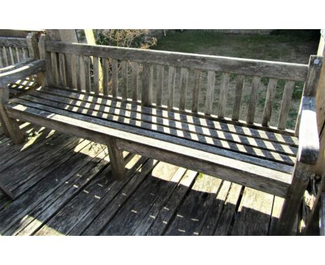 A good quality weathered teak garden bench, 240cm long 
