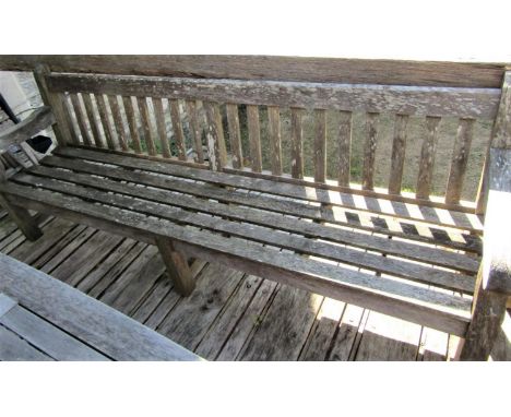 A good quality weathered teak garden bench, 240cm long 