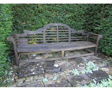An old teak garden bench in the Lutyens manner (some restoration required) 260cm wide 