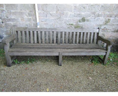 A good quality teak garden bench, 240cm long approx 