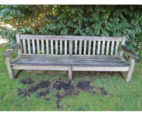 A good weathered teak wood garden bench, 240cm wide 