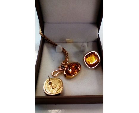 Swarovski crystal necklace with a pair of earrings