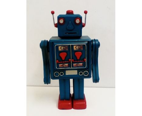 Tin plate money box in the form of a robot, height  36cm