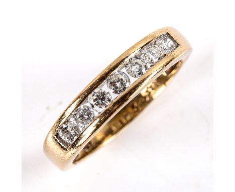 A modern 9ct gold 7-stone diamond half eternity ring, channel set with modern round brilliant-cut diamonds, total diamond con