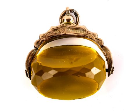 An early 20th century 9ct gold faceted citrine swivel fob, foliate engraved mount, hallmarks Chester 1914, citrine length 25.