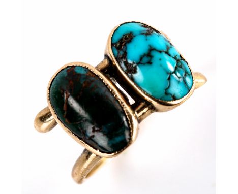 A Continental unmarked gold double-turquoise crossover ring, set with oval cabochon turquoise matrix, setting height 12.3mm, 