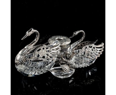 A graduated set of 3 silver-mounted cut-glass swan table salts, and a silver-mounted glass dressing table jar (4)Lot sold as 