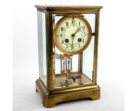 An early 20th century French brass-cased 4-glass 8-day mantel clock, cream enamel dial with Arabic numerals and hand painted 