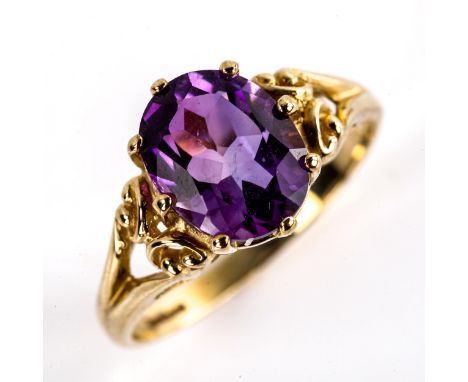 A modern 9ct gold amethyst dress ring, set with oval mixed-cut amethyst and openwork shoulders, setting height 11.1mm, size P