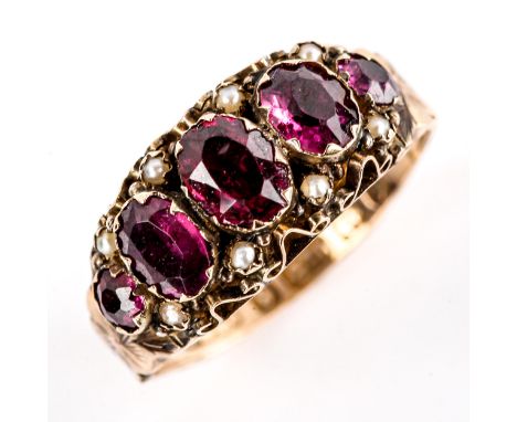 A Victorian 9ct gold garnet and pearl half hoop ring, set with oval mixed-cut garnets and floral engraved shank, hallmarks Bi