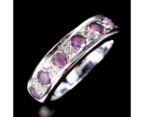 A modern 18ct white gold ruby half eternity ring, set with round-cut rubies, setting height 5.2mm, size J, 6.3gNo damage or r