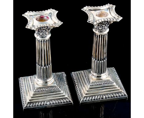 ASPREY - a pair of George V silver squat Corinthian column table candlesticks, with removable sconces, by Asprey & Co Ltd, ha