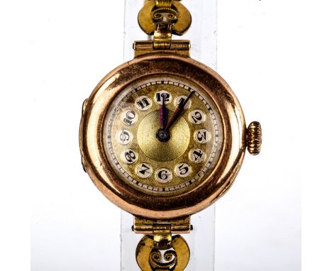 A lady's Vintage 9ct gold cased mechanical wristwatch, gilt dial with Arabic numerals and blued steel hands, on gold plated b