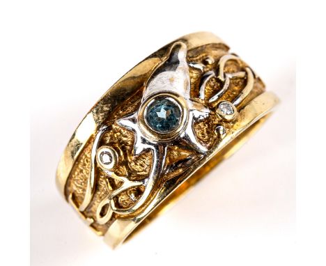 A modern 9ct yellow and white gold blue topaz and diamond abstract band ring, setting height 9.9mm, size L, 5.1gNo damage or 