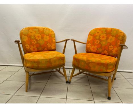 A pair of very good Ercol blonde Windsor chairs