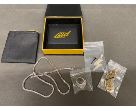 4 x costume jewellery items, unused by GLD , a diamanté necklace, a gold plated necklace, a diamanté encrusted lightening rin