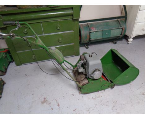 A vintage Qualcast Suffolk engine model 22A type 7SG14 petrol lawn mower with grass box and roller 