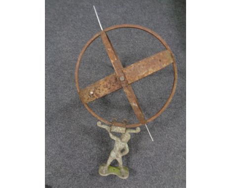 A cast iron armillary spear on atlas base 