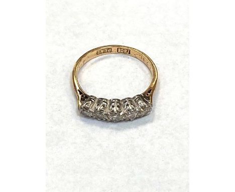 An 18ct gold and platinum five stone diamond ring, size J.  CONDITION REPORT: 2.1g