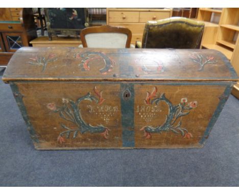 A 19th century hand painted domed-topped shipping trunk with key 