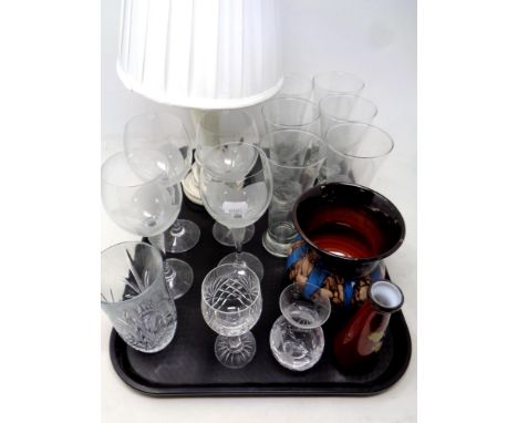 A tray of assorted drinking glasses, Swedish pottery vase, table lamp and shade 