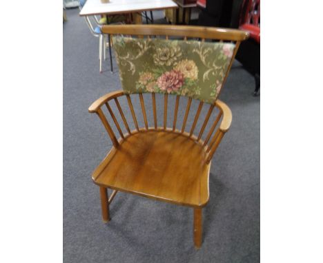 A mid 20th century beech wood stick back armchair 