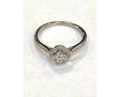 An 18ct white gold fancy diamond cluster ring with diamond shoulders, approximately 0.35ct, size L.