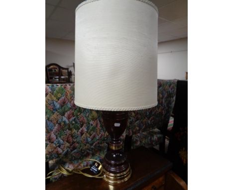 A brass and wooden table lamp with shade 