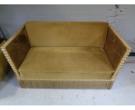 A twentieth century drop end sofa upholstered in golden fabric 