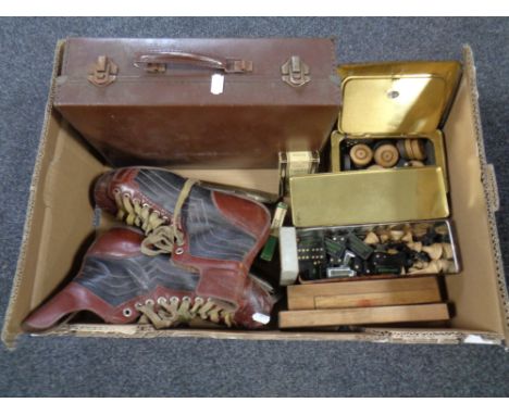 A box of vintage leather briefcase, vintage ice skates, playing cards by Hovis, dominoes and chess pieces bearing Woodbine ad