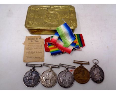 A Christmas 1914 brass tin containing; A WWI British War Medal and Mercantile Marine Medal named to WT. Eng. J. Dryburgh. R.N