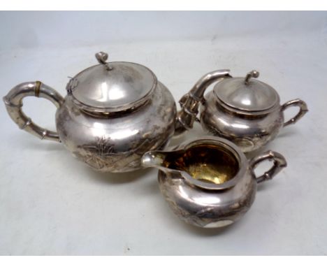 A Chinese silver three piece tea service, with bamboo decoration, markings to base  CONDITION REPORT: 824g gross