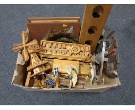 A box of match stick models of a vintage car and a trolley bus, plastic model of a galleon, marquetry panel, sword mounted on