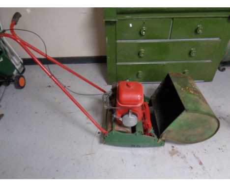 A vintage Suffolk Punch model 21A petrol lawn mower with grass box and roller 