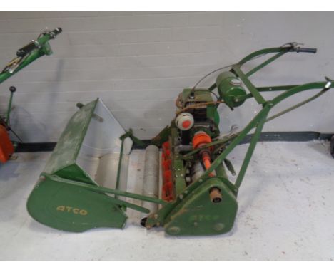 A vintage Atco petrol lawn mower with Villiers 1100 engine with built in roller and grass box 