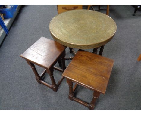 A pair of oak lamp tables together with an Eastern brass table on folding base 