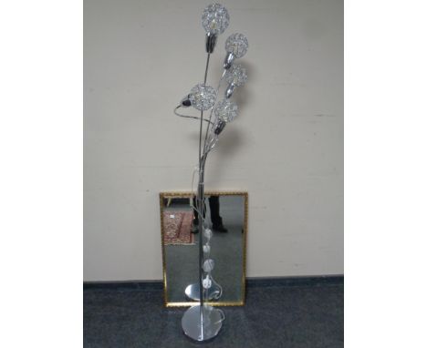 A contemporary chrome metal five way floor lamp together with a gilt framed bevelled edge mirror 