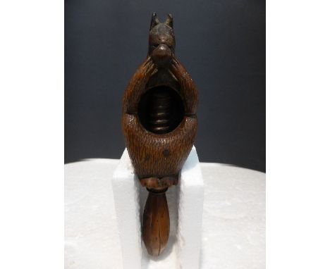 Treen nutcracker carved as a squirrel, screw twist, yew handle, length 17.5cm