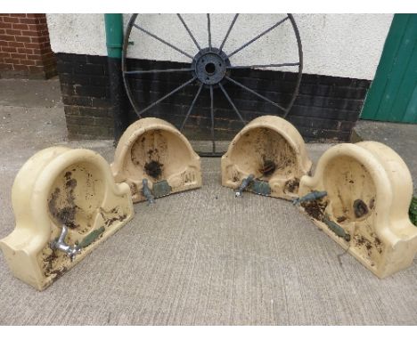Four early 20th century buff ceramic toilet sinks with single taps, two marked William F Farrer (width 46cm depth 40cm)