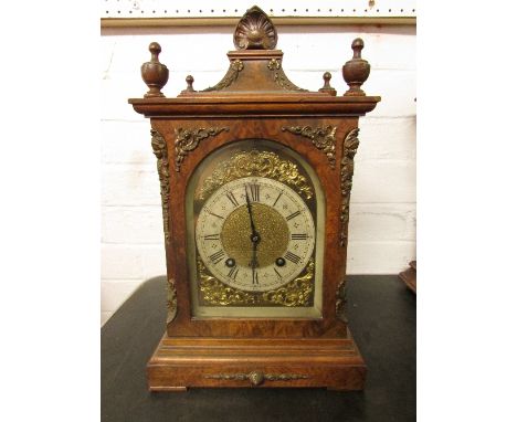 Walnut veneered chiming mantel clock with applied brass mask heads and foliage, the movement marked LENZKIRCH A.G.V 52 940652