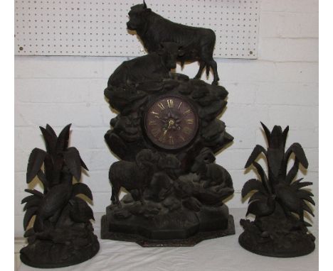 A large Black Forest carved mantel clock with a simple chiming movement serial 1688 marked P.R. formed as a rocky outcrop wit