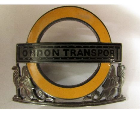 London Transport silver and enamel badge, yellow roundel supported on two griffin, numbered 3755, Birmingham assay, date lett