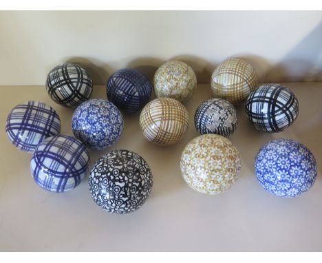 A collection of 12 19th century Scottish Pottery carpet bowls and a jack - 8cm x 7cm diameter - various patterns in a wicker 