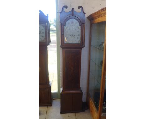 An 8 day longcase clock with a painted arched dial with a second hand and a calendar in an oak case - Height 210cm - with wei