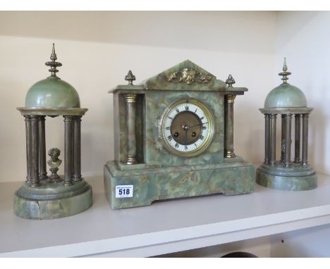 A French mottled marble 8 day striking clock set - working in the saleroom 