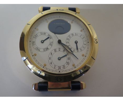 A Cartier chronograph table clock with moon phase day, date and hour dial numbered to back 8913 00990 