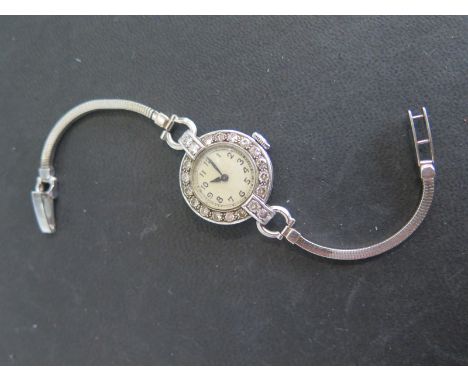 A Platinum and diamond ladies Cyma manual wind cocktail watch on a 9ct white gold strap - Width 25mm including winder - total