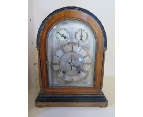 A German mantle clock, silvered dial with Roman numerals to chapter ring, adjustable movement with chime or silent, chimes on